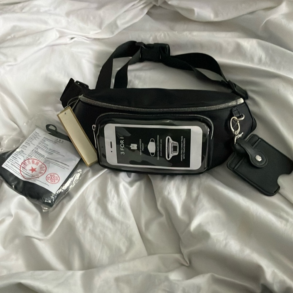 New never used, Unisex Black Crossbody fanny pack.